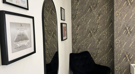 A stylish corner with certificates and mirror at Vasilica Manchester Aesthetics in Dukinfield, England, GB.