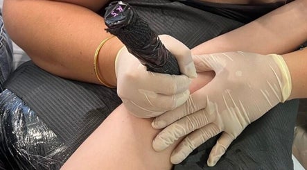 Tattoo artist at Haven Ink & Beauty Studio inking client in Perth, Western Australia, AU.