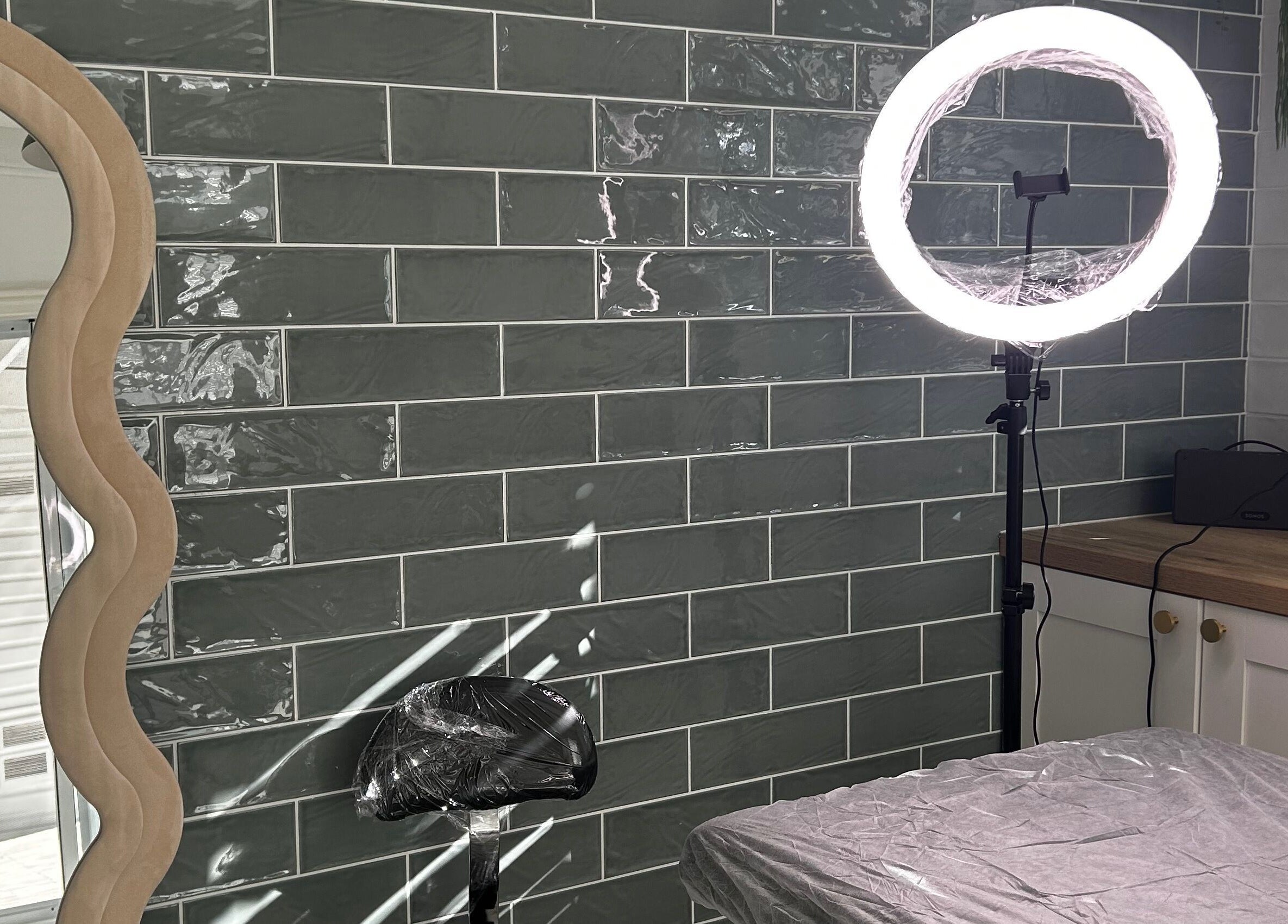 Modern setup at Haven Ink & Beauty Studio, Dawesville, Western Australia, AU with mirror and ring light.