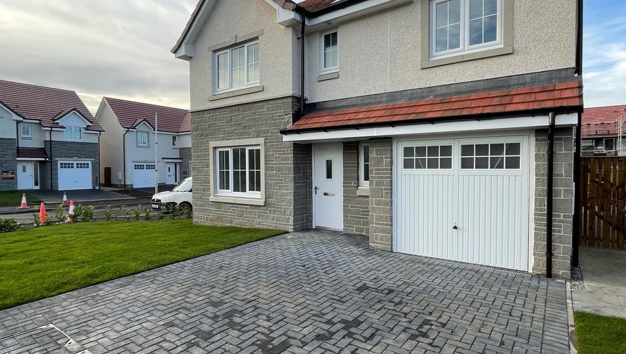 Modern residential exterior near KB Nails, Livingston, Scotland, GB, highlighting clean design and structure.