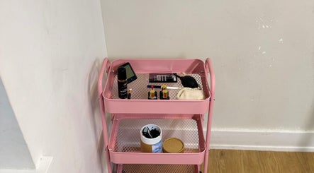 Pink beauty cart with cosmetics at Ellas Beauty Haven, Aberchirder, Scotland, GB.