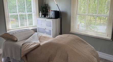 Cozy treatment room at Root and Remedy Wellness in Purleigh, England, GB with soft linens and natural light.