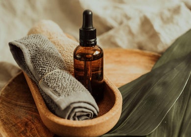 Spa towel and essential oil at Root and Remedy Wellness, Purleigh, England, GB for ultimate relaxation.