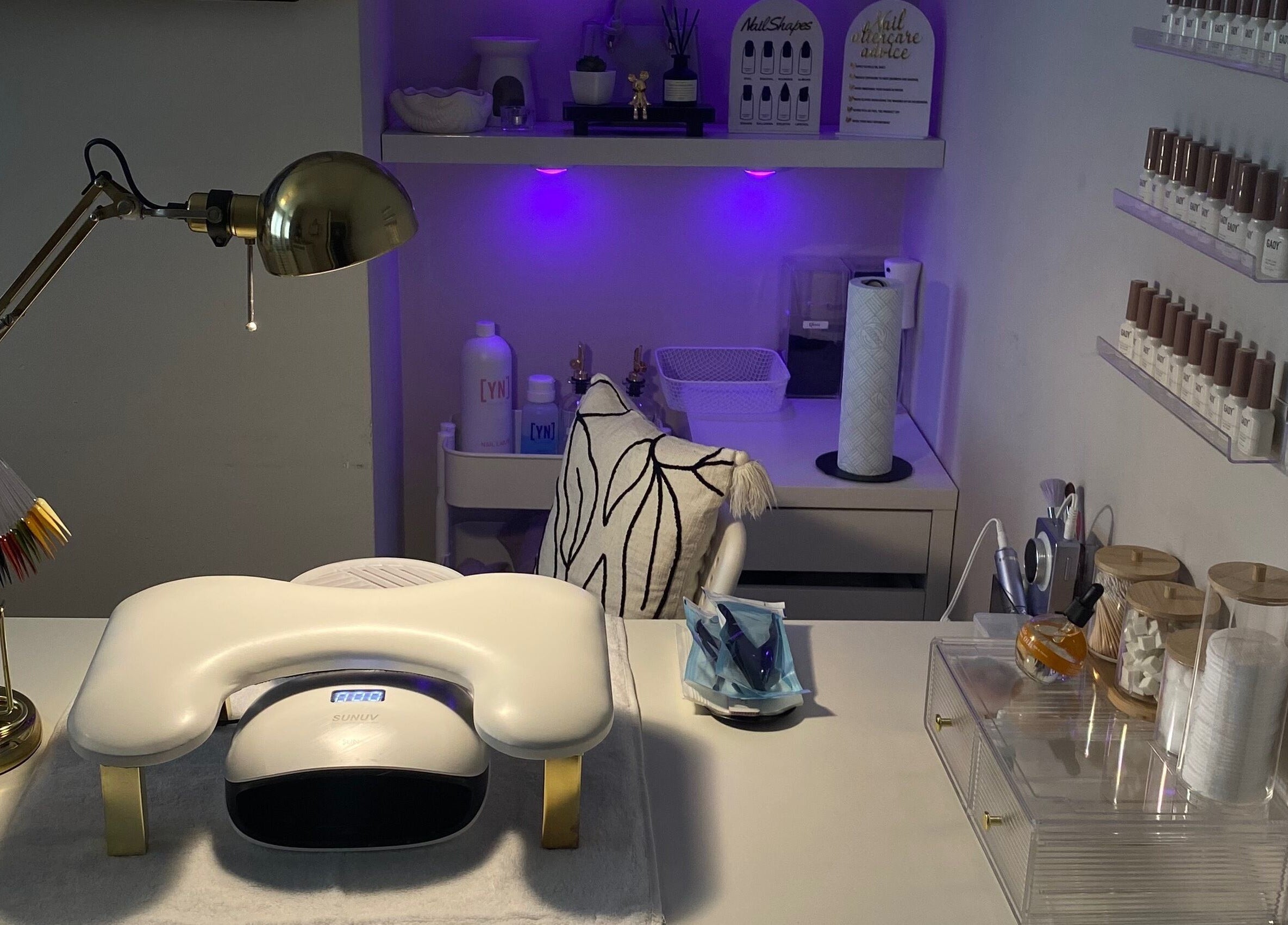 Modern nail workspace at Nina’s Nail Studio, Dublin, County Dublin, IE, showcasing tools and a lamp.