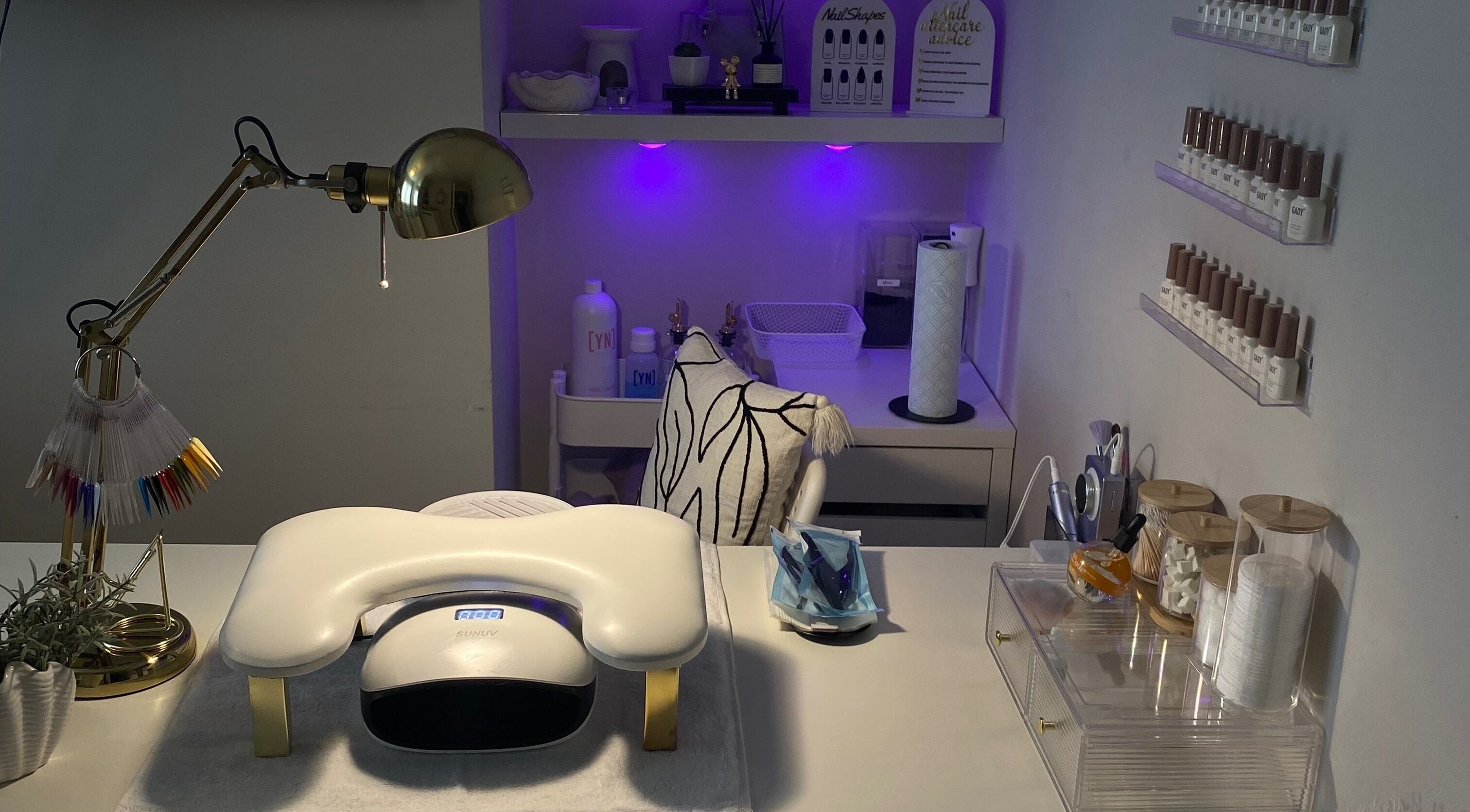 Modern nail workspace at Nina’s Nail Studio, Dublin, County Dublin, IE, showcasing tools and a lamp.