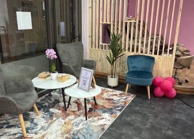 Chic waiting area with plush seating at Blush and Buff, Cape Town, Western Cape, ZA, offering a relaxing vibe.