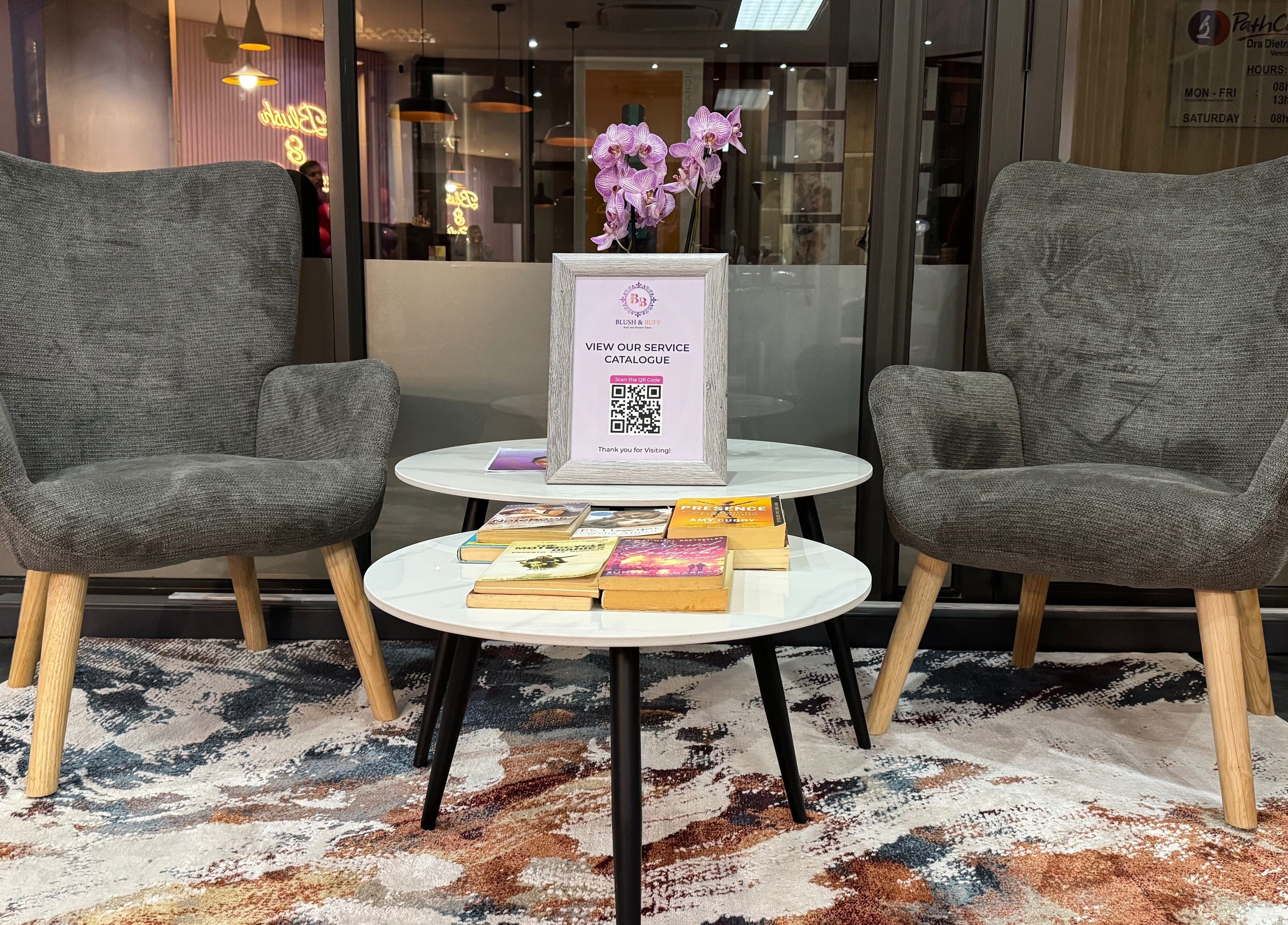 Comfortable seating at Blush and Buff, Cape Town, Western Cape, ZA. Elegantly arranged chairs and table.