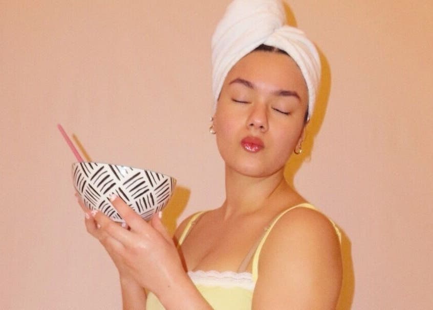 Relaxed woman with face mask at You're So Golden Esthetics, El Paso, Texas, US, exudes tranquility.