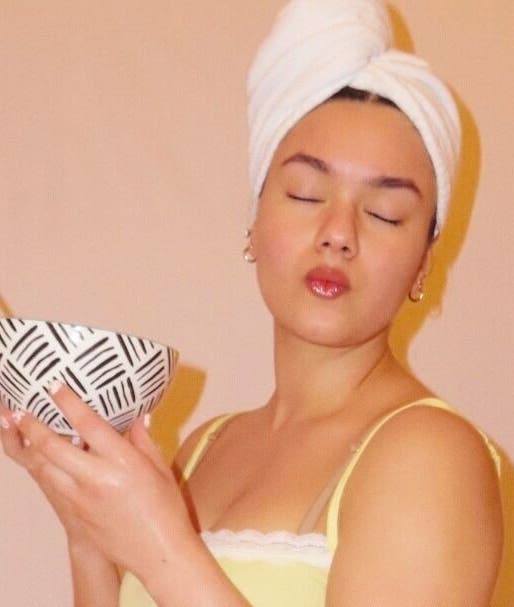 Relaxed woman with face mask at You're So Golden Esthetics, El Paso, Texas, US, exudes tranquility.