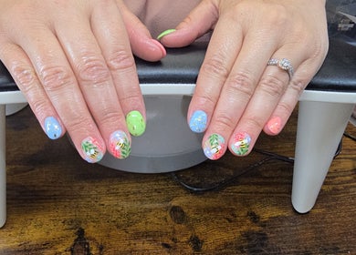 Vibrant floral nail art at Kalos & Grace, Ballymoney, Northern Ireland, GB, showcasing colorful designs.