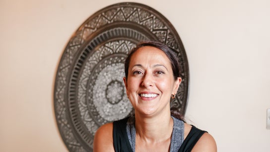 Smiling practitioner at Balance And Bloom Ayurveda, Higher Ground, Brighton And Hove, England, GB.