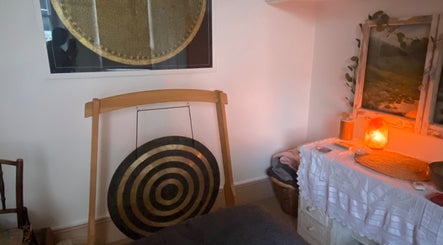 Serene interior of Balance And Bloom Ayurveda - Home Studio in Brighton And Hove, featuring a gong and salt lamp.