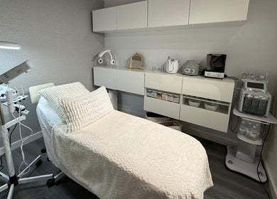 Treatment room at Nua Med Spa in Hialeah, Florida, US, featuring a comfortable bed and modern equipment.