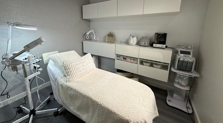 Treatment room at Nua Med Spa in Hialeah, Florida, US, featuring a comfortable bed and modern equipment.