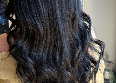 Smooth black waves styled at Einna Harris Hair, Burswood, Western Australia, AU, showcasing elegant hair design.