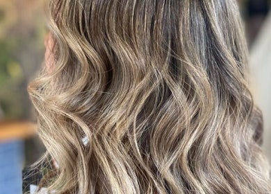 Elegant wavy hairstyle at Einna Harris Hair, Burswood, Western Australia, AU. Perfect for a timeless look.