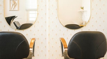 Chic salon chairs and mirrors at Hair with Gretta in Caloundra, Queensland, AU, offering a stylish ambiance.
