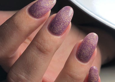 Close-up of sparkling violet manicured nails at Sonneblom&Co in Springs, Gauteng, ZA.