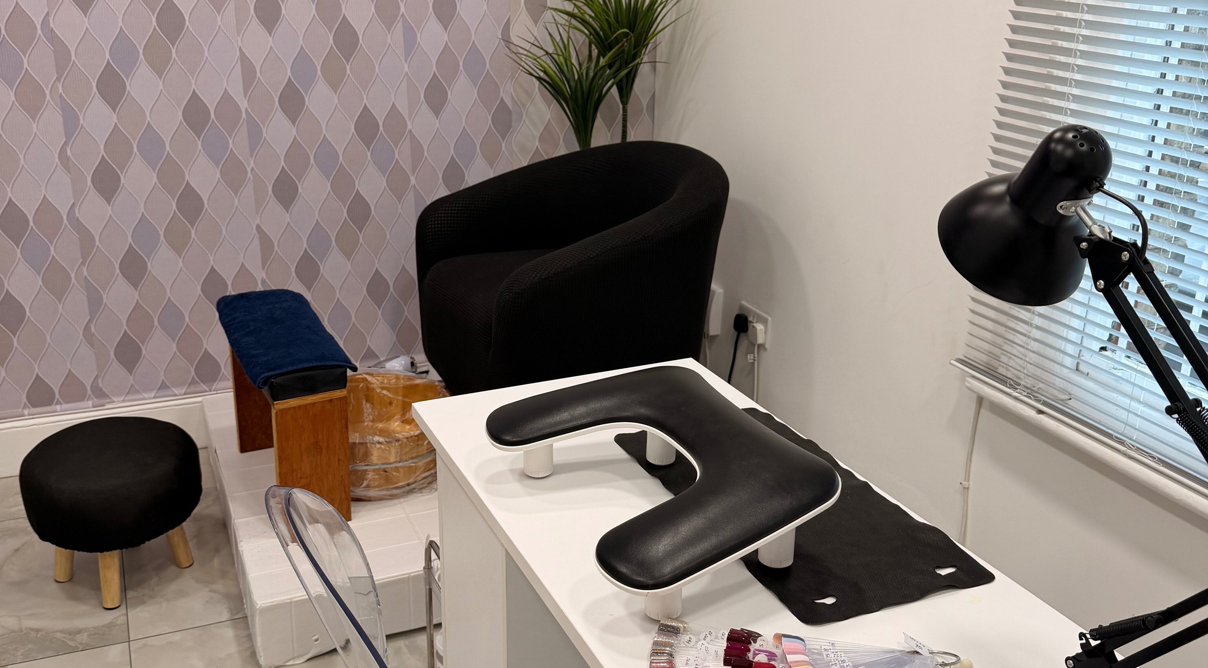 Cozy nail station at Suav Nails Beauty, Enfield, England, GB, with modern decor and manicure tools.