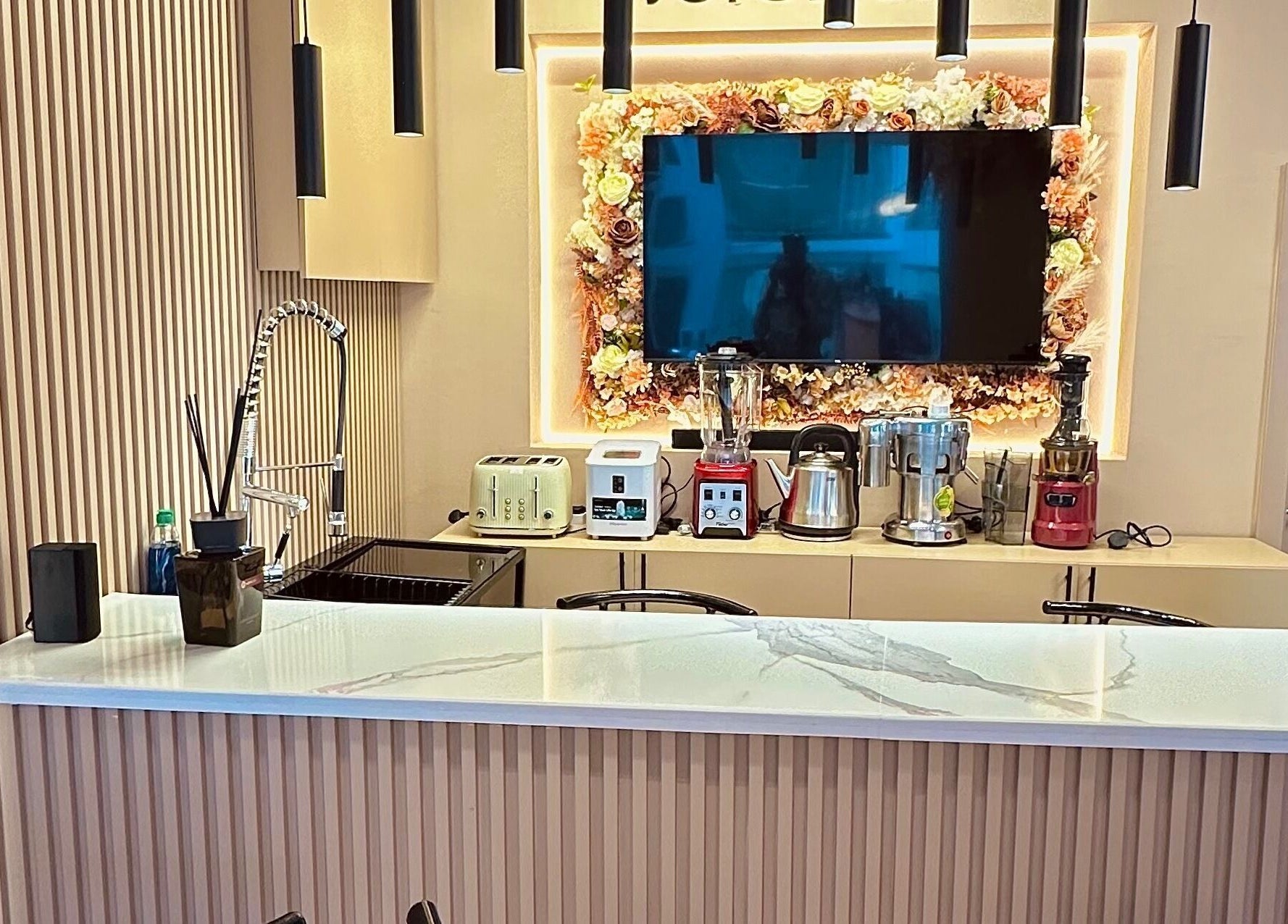 Modern kitchenette with appliances at Elevoire Beauty Lounge, Abuja, Federal Capital Territory, NG.