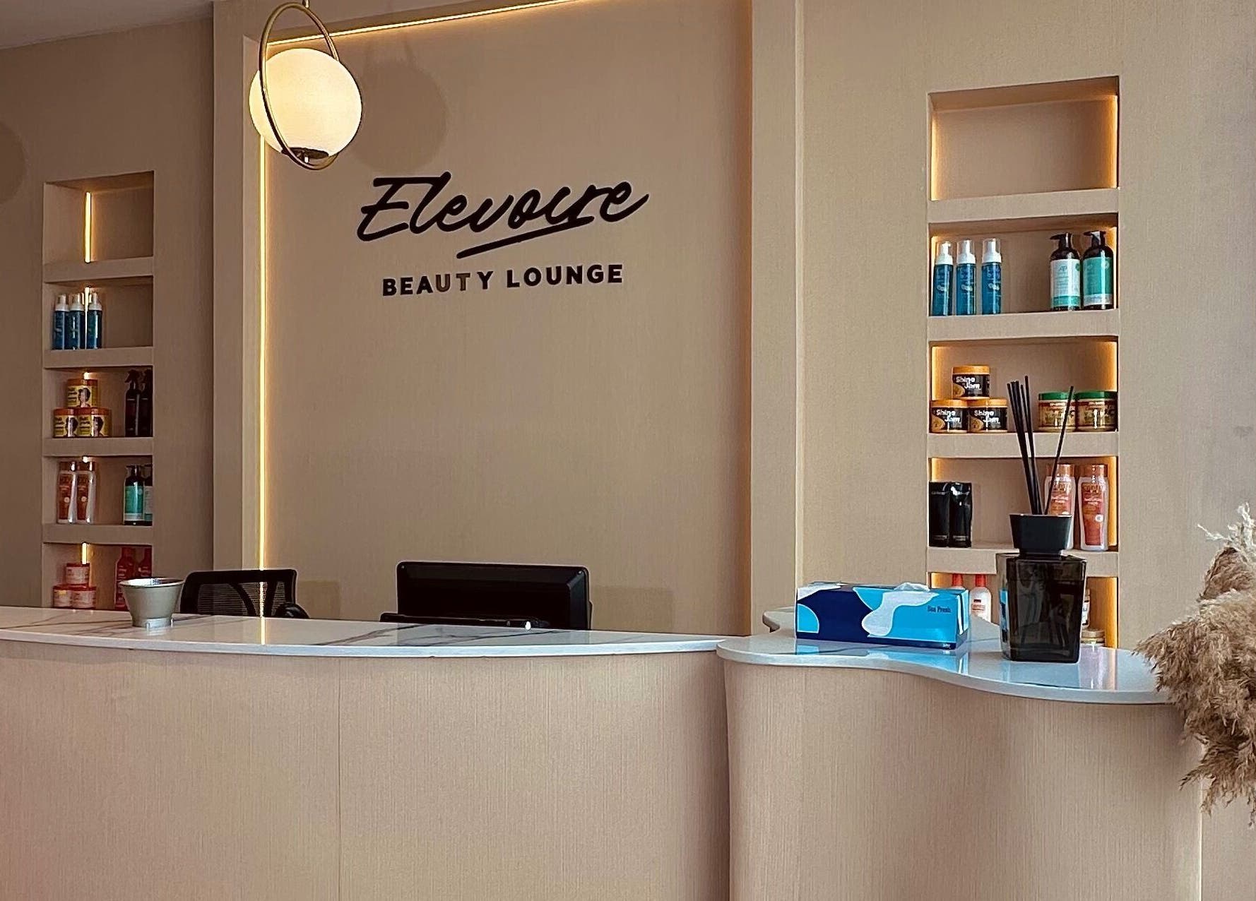 Sleek reception at Elevoire Beauty Lounge, Abuja, Federal Capital Territory, NG with stylish decor and lighting.