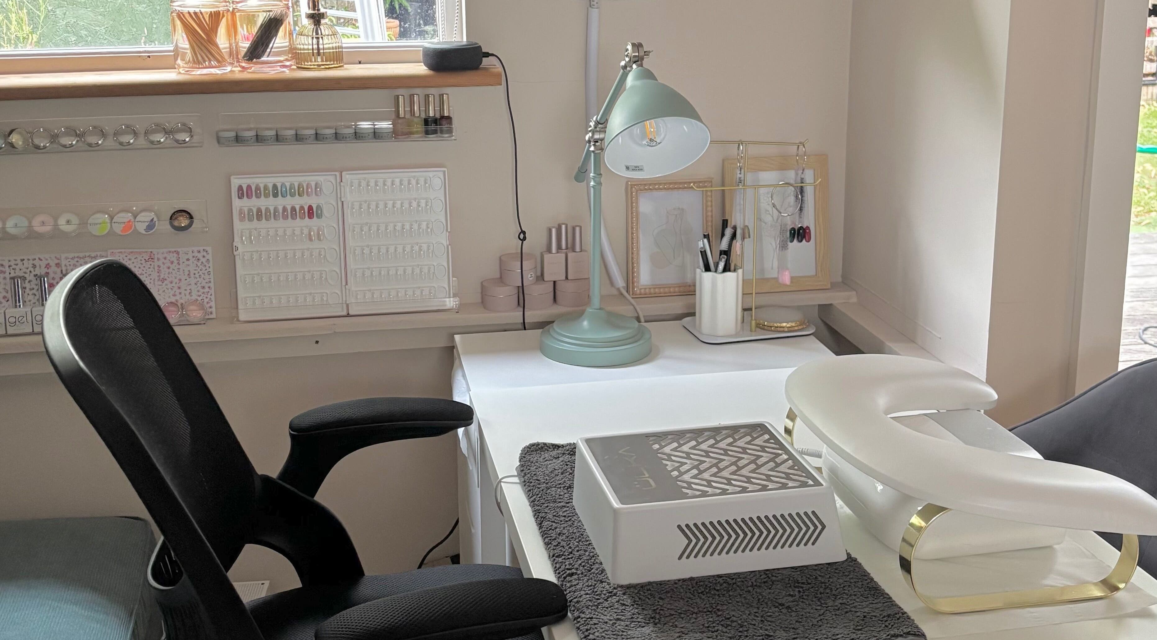 Elegant nail salon station at Bebe Nails, New Malden, England, GB, featuring manicure tools and modern decor.