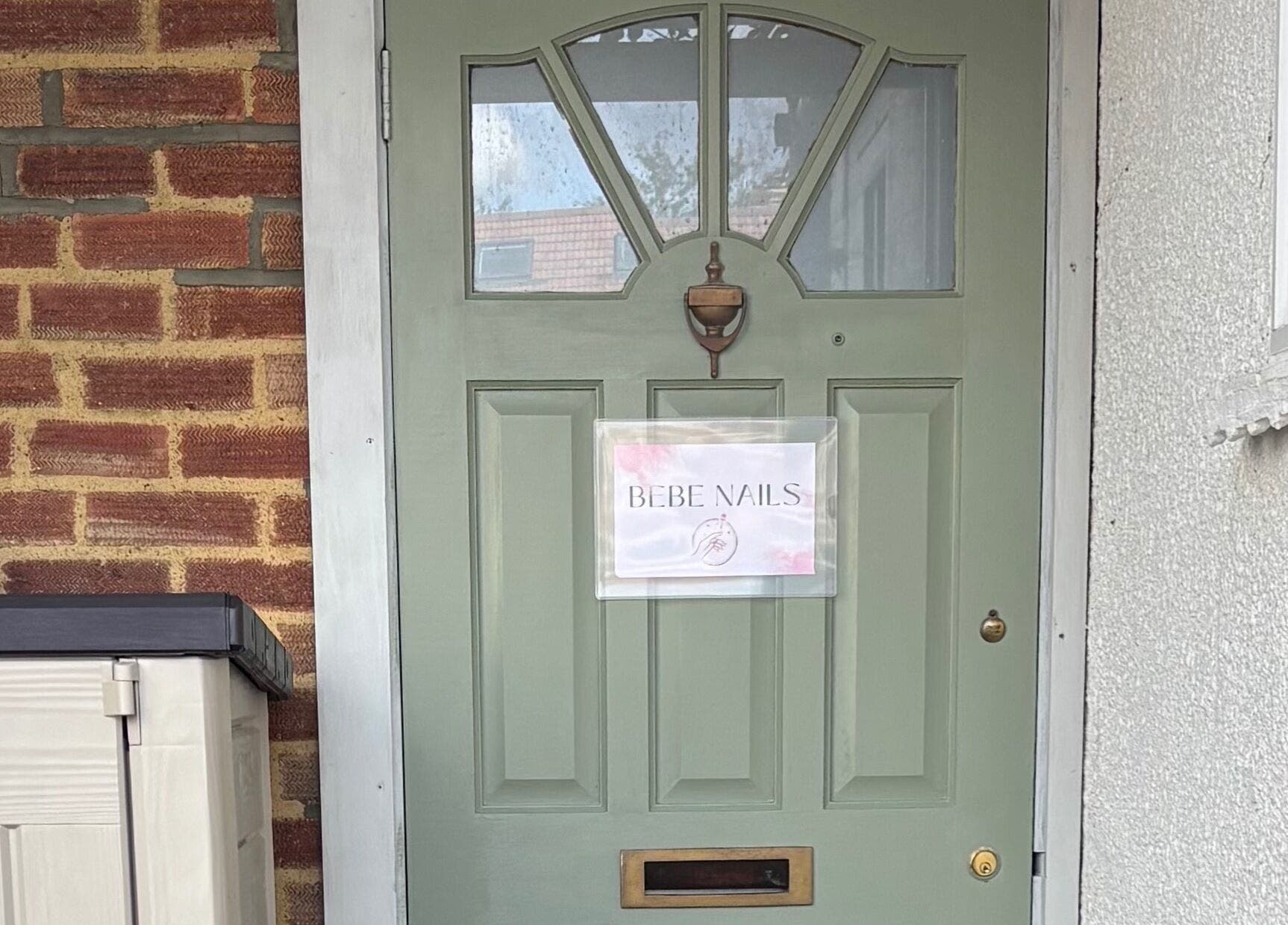 Front door of Bebe Nails, New Malden, England, GB with welcoming sign.
