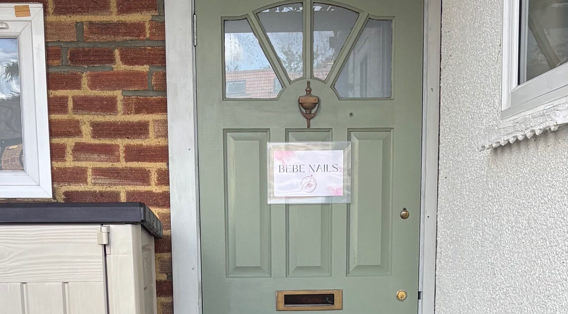 Front door of Bebe Nails, New Malden, England, GB with welcoming sign.