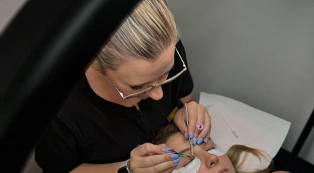 Lash artist applying extensions at Lashes by Lucia, Cape Town, Western Cape, ZA.