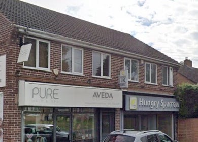 Front view of The Nik Effect, a beauty venue in Birmingham, England, GB with a stylish brick exterior.