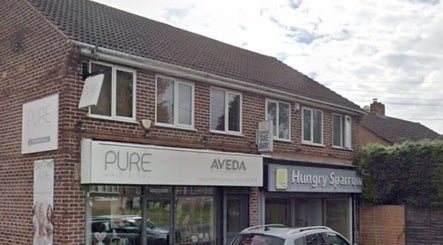 Front view of The Nik Effect, a beauty venue in Birmingham, England, GB with a stylish brick exterior.