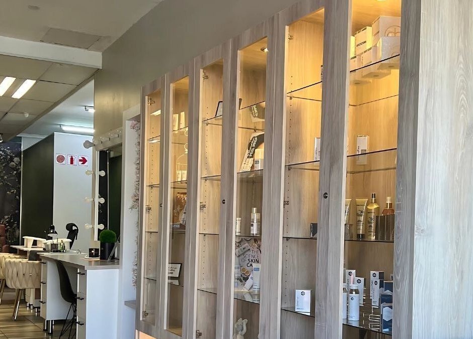 Ayla Glow Bar in Boksburg, Gauteng, ZA features chic shelving displaying skincare products.