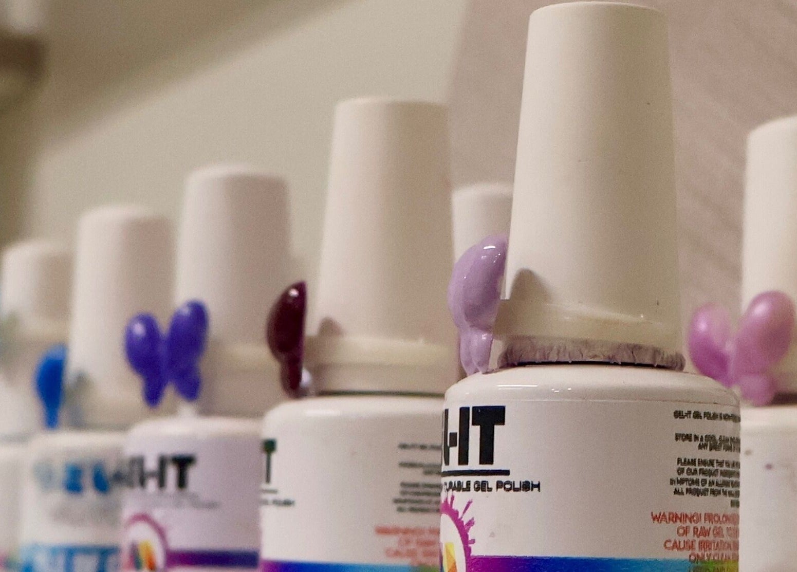 Nail polish bottles at Ayla Glow Bar, Boksburg, Gauteng, ZA, showcasing vibrant colors.