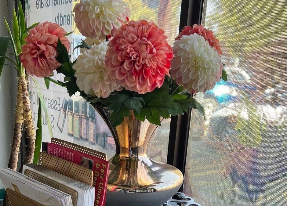 Elegant flower arrangement by the window at Ayla Glow Bar, Boksburg, Gauteng, ZA.