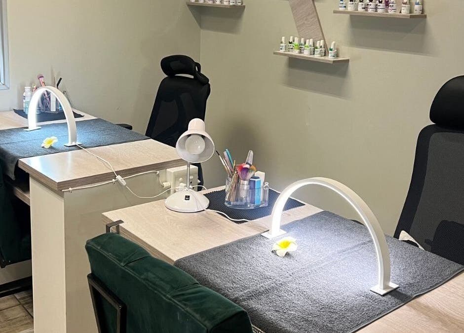 Ayla Glow Bar's chic nail stations in Boksburg, Gauteng, ZA with lush chairs and organized tools.