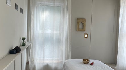 Peaceful spa room at FOLK, Perranporth, England, GB, featuring soft lighting and minimalist decor.
