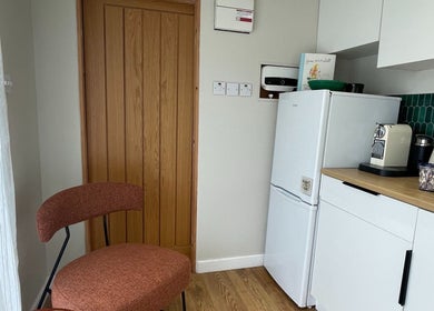 Cozy kitchen corner at FOLK, Perranporth, England, GB with stylish seating and modern appliances.