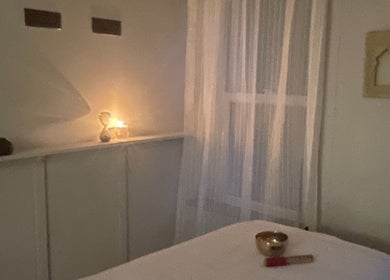 Calm massage room at FOLK, Perranporth, England, GB, with candlelight ambience.