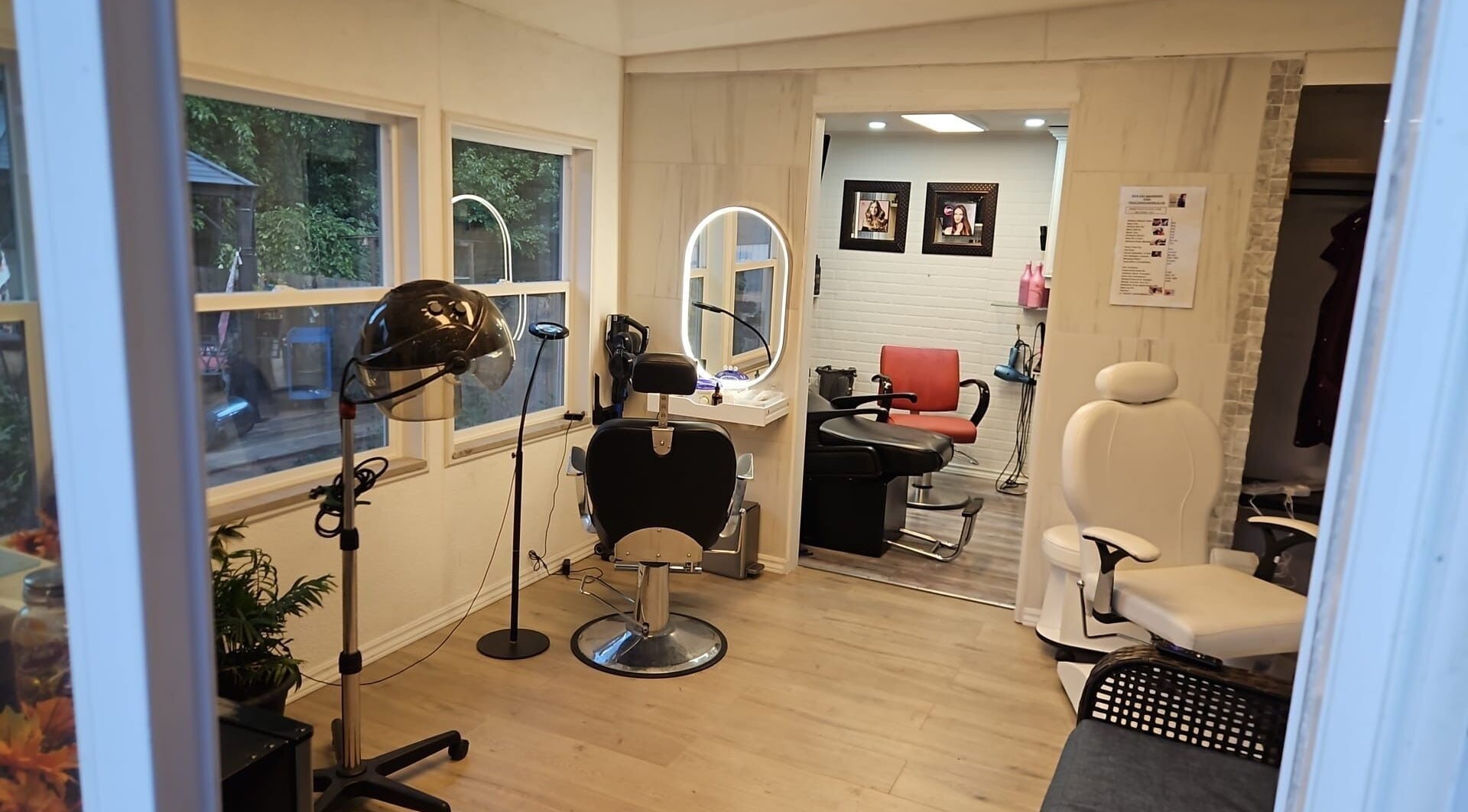 Modern salon interior at Jane hairstylist in Hamilton, Ontario, CA, featuring stylish seating and large mirrors.