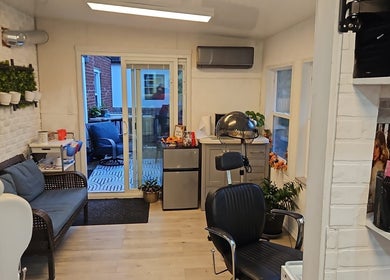 Cozy salon interior at Jane hairstylist in Hamilton, Ontario, CA showcasing modern decor and styling chair.