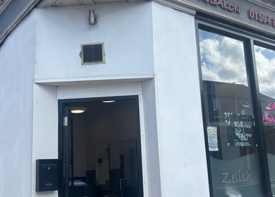 Entrance of hairbyrosie salon in Lydney, England, GB highlighting modern design and inviting vibe.
