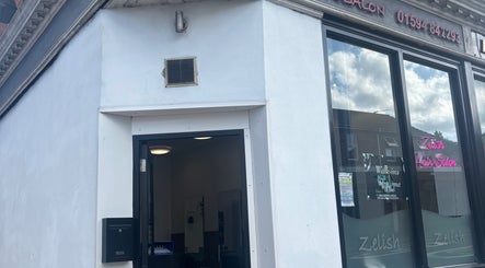 Entrance of hairbyrosie salon in Lydney, England, GB highlighting modern design and inviting vibe.