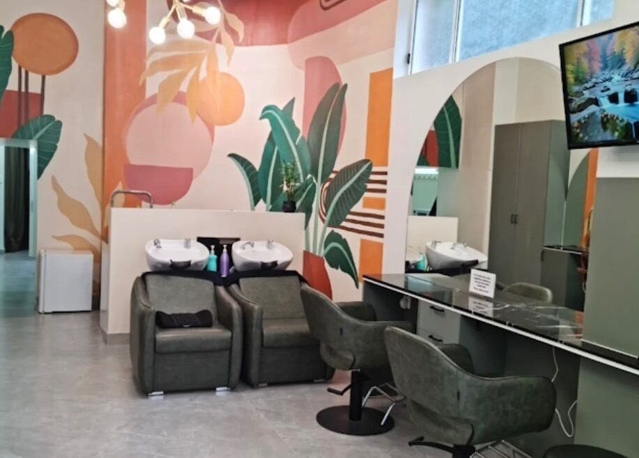 Modern salon interior at Hair by Greshan, Edgecliff, New South Wales, AU, featuring stylish seating and vibrant decor.