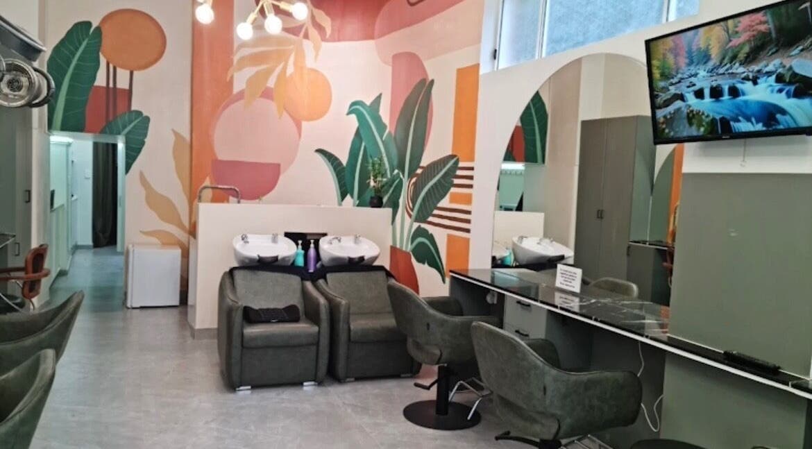 Modern salon interior at Hair by Greshan, Edgecliff, New South Wales, AU, featuring stylish seating and vibrant decor.