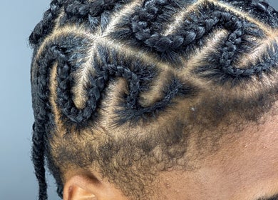 Intricate cornrow braids styled at Chineeys Hairempire, San Fernando, San Fernando City Corporation, TT.