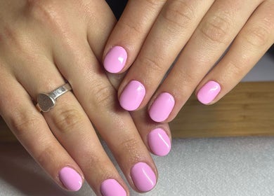 Beautiful pink manicure at Mano Mona Nails, Bondi Beach, New South Wales, AU. Perfectly polished nails shine brightly.