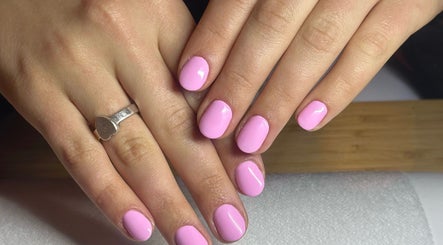 Beautiful pink manicure at Mano Mona Nails, Bondi Beach, New South Wales, AU. Perfectly polished nails shine brightly.