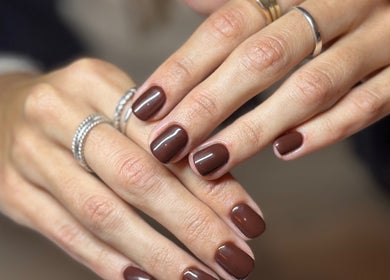 Stylish cocoa nails with rings at Mano Mona Nails, Bondi Beach, New South Wales, AU.