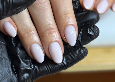 Freshly manicured nails in soft pink at Mano Mona Nails, Bondi Beach, New South Wales, AU.