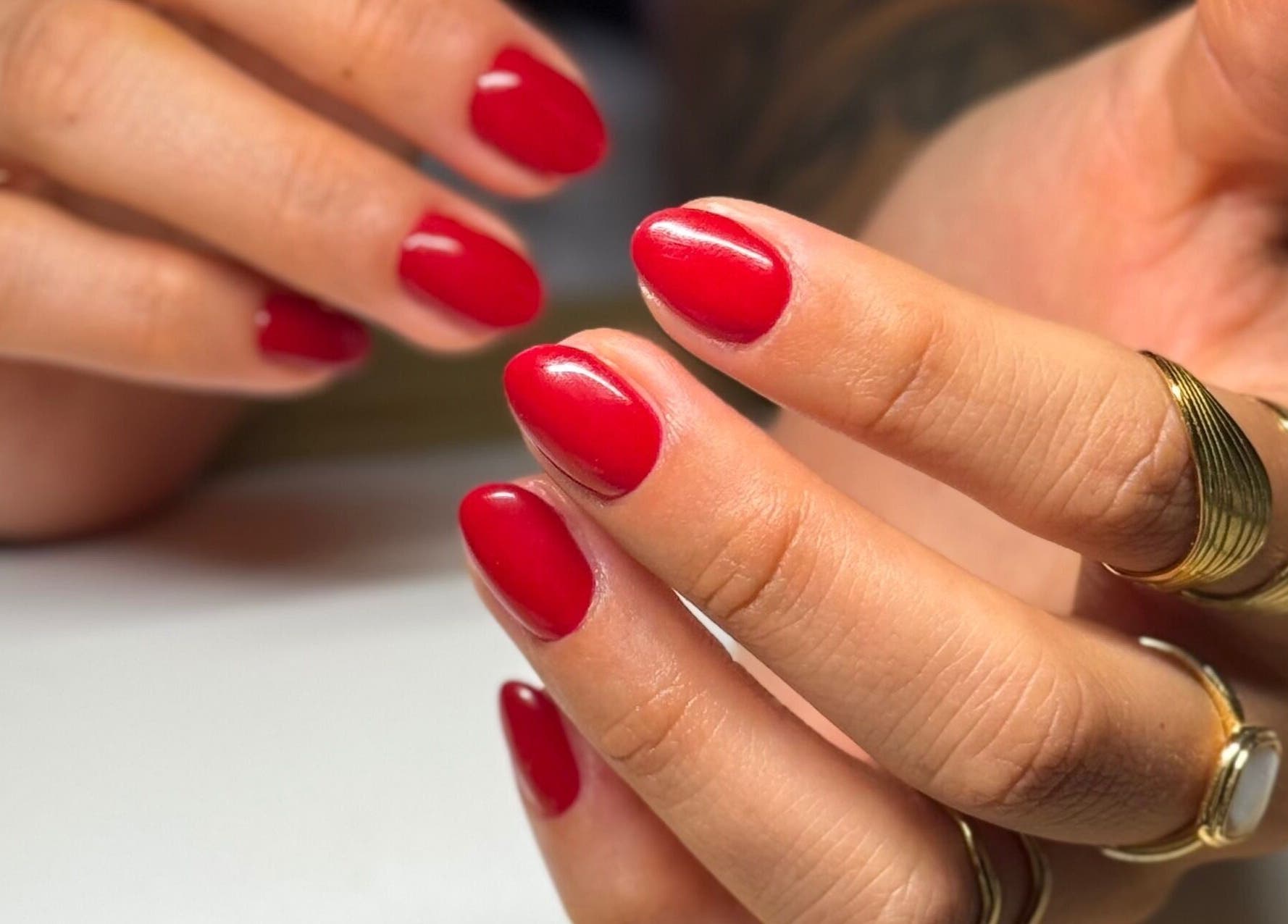 Close-up of red manicured nails at Mano Mona Nails, Bondi Beach, New South Wales, AU.